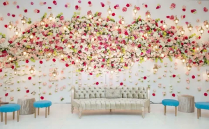 The Perfect Backdrop: White Flower Walls for Stunning Wedding Reception Photos